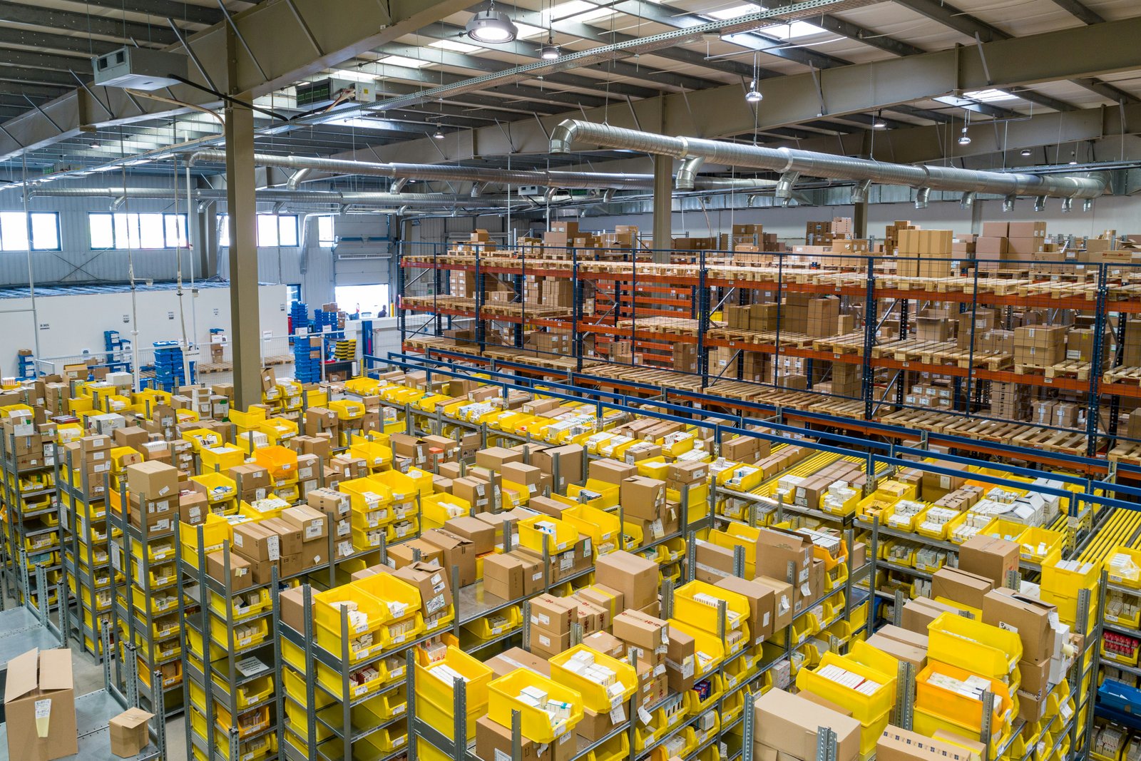 Procurement professionals coordinating shipments in a modern warehouse